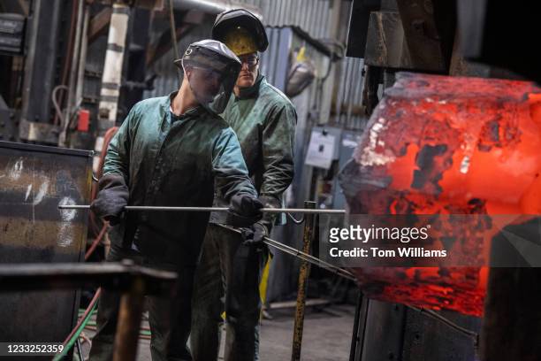 Steelworkers attend to rolled steel at Lehigh Heavy Forge as Secretary of Labor Marty Walsh, and Rep. Susan Wild, D-Pa., toured the plant while...