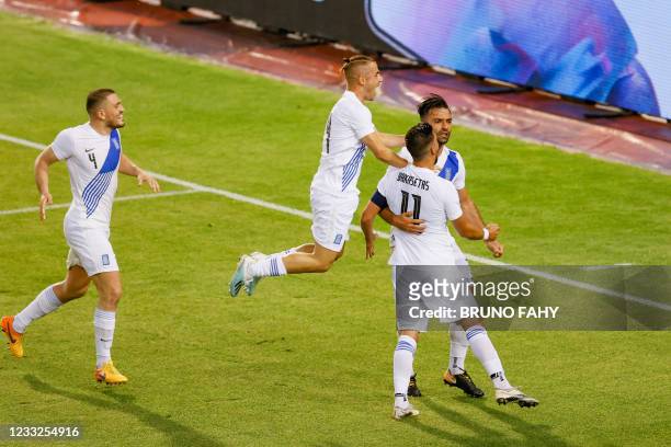 Greece Giorgos Tzavellas celebrates after scoring during a friendly game of the Belgian national soccer team Red Devils and Greece national team, in...