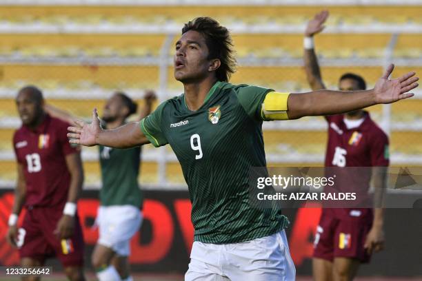 Bolivia's Marcelo Martins celebrates after scoring the team's third goal against Venezuela during their South American qualification football match...