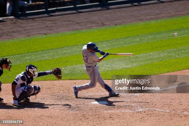 Jose Trevino of the Texas Rangers hits a two-run home run during the ninth inning against the Colorado Rockies at Coors Field on June 3, 2021 in...