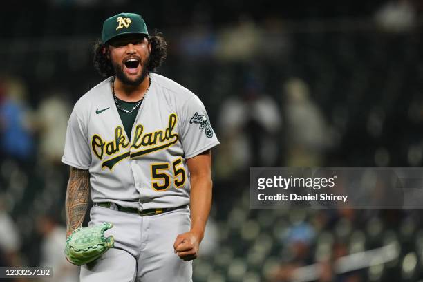 Sean Manaea of the Oakland Athletics celebrates the win after pitching a complete game between the Oakland Athletics and the Seattle Mariners at...