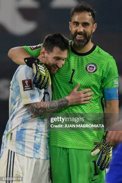Argentina's Lionel Messi and Chile's goalkeeper Claudio Bravo greet each other after tying 1-1 in their South American qualification football match...