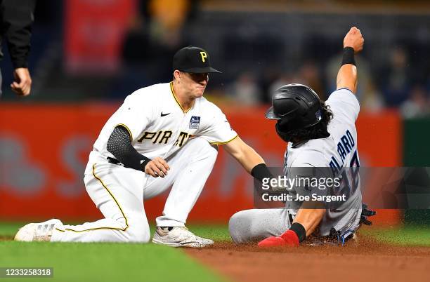 Jorge Alfaro of the Miami Marlins safely steals second base in front of Kevin Newman of the Pittsburgh Pirates during the seventh inning at PNC Park...