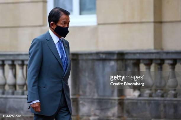 Taro Aso, Japan's deputy prime minister and finance minister, arrives on the first day of the Group of Seven Finance Ministers summit in London,...