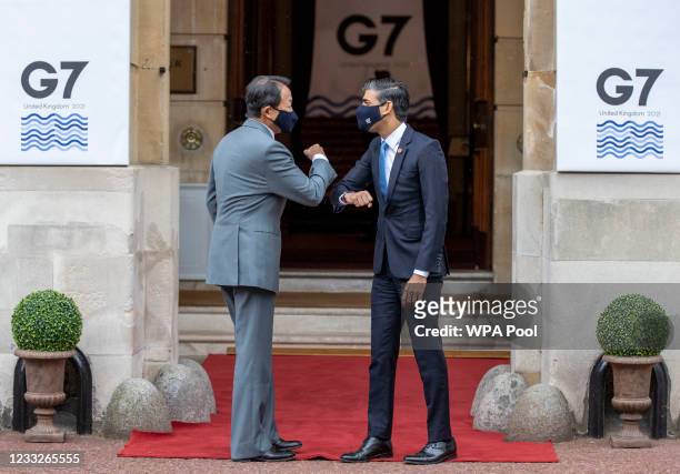 Chancellor of the Exchequer Rishi Sunak welcomes Japan's finance minister Taro Aso to the G7 finance ministers meeting on June 4, 2021 in London,...