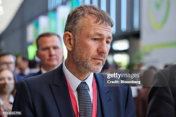 Andrey Melnichenko, billionaire and owner of EuroChem Group AG, walks between sessions on day three of the St. Petersburg International Economic...
