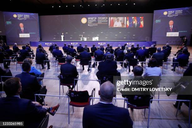 Russian President Vladimir Putin gives a speech during a plenary session of the St. Petersburg International Economic Forum in Saint Petersburg on...