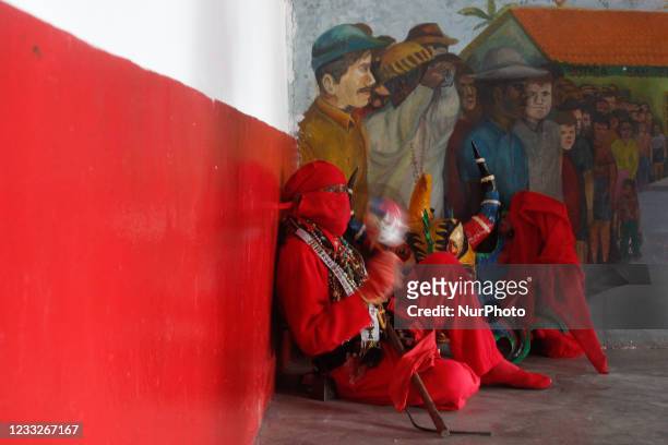 Man dressed as a dancing devil plays a maraca during the celebration of Corpus Christi amidst the Coronavirus pandemic in San Francisco de Yare,...
