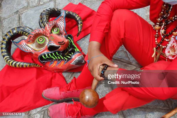 Devil mask on the floor during the celebration of Corpus Christi, amidst the Coronavirus pandemic in San Francisco de Yare, Miranda, Venezuela on...