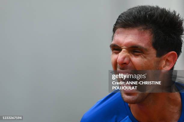 Argentina's Federico Delbonis celebrates after winning against Italy's Fabio Fognini during their men's singles third round tennis match on Day 6 of...