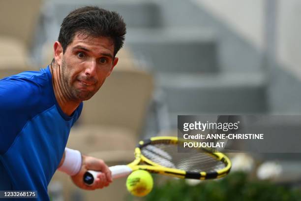 Argentina's Federico Delbonis returns the ball to Italy's Fabio Fognini during their men's singles third round tennis match on Day 6 of The Roland...