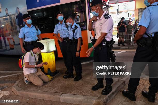 Police search a man near Victoria Park in the Causeway Bay district of Hong Kong on June 4 after police closed Victoria Park where Hong Kong people...