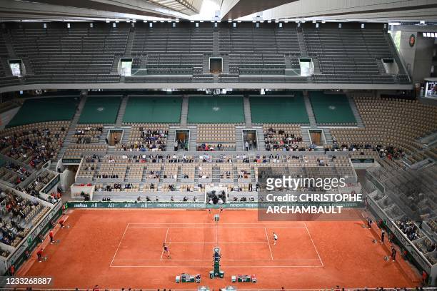 General view of the Philippe Chatrier court with its retractable roof as Germany's Alexander Zverev returns the ball to Serbia's Laslo Djere during...