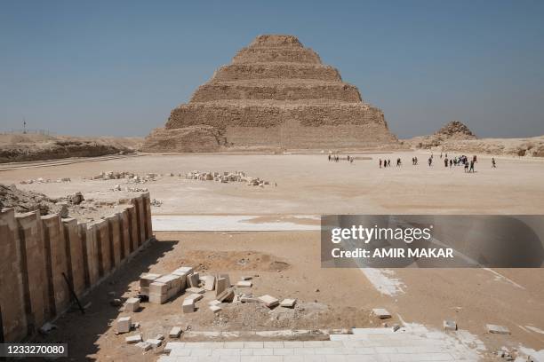 Visitors approach the entrance to the step pyramid of the third dynasty Ancient Egyptian king Djoser at the Saqqara Necropolis south of Egypt's...