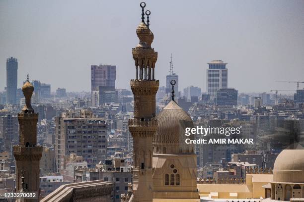 This picture taken on May 26, 2021 from the Cairo Citadel overlooking the Egyptian capital shows a view of the dome and minarets of the 20th century...