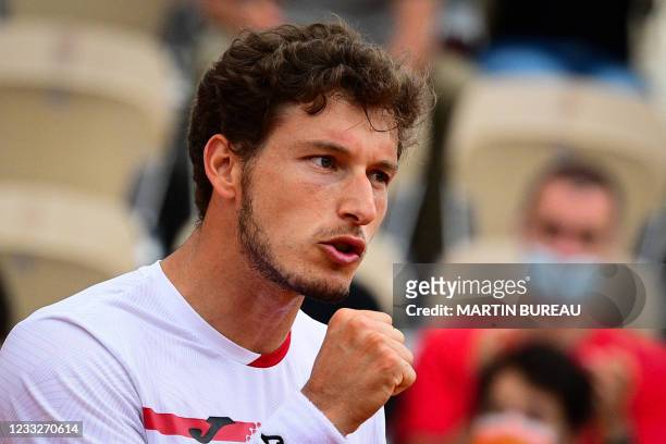 Spain's Pablo Carreno Busta celebrates after winning against Steve Johnson of the US during their men's singles third round tennis match on Day 6 of...