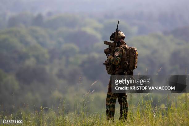 Soldier patrols the Terhills site at Nationaal Park Hoge Kempen in Maasmechelen, Friday 04 June 2021. Police and army services continue to look for a...