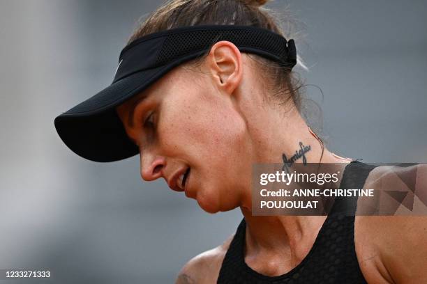 Slovenia's Polona Hercog reacts as she plays against Czech Republic's Marketa Vondrousova during their women's singles third round tennis match on...