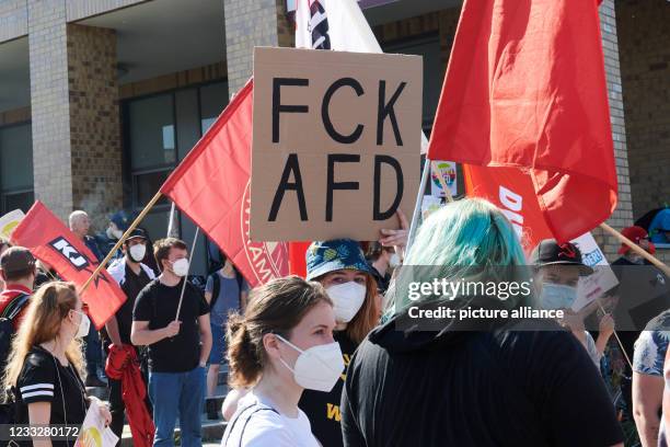 Is written on a poster of a demonstrator. Protests of various anti-racist groups gather around the party conference of the AfD. This takes place in a...