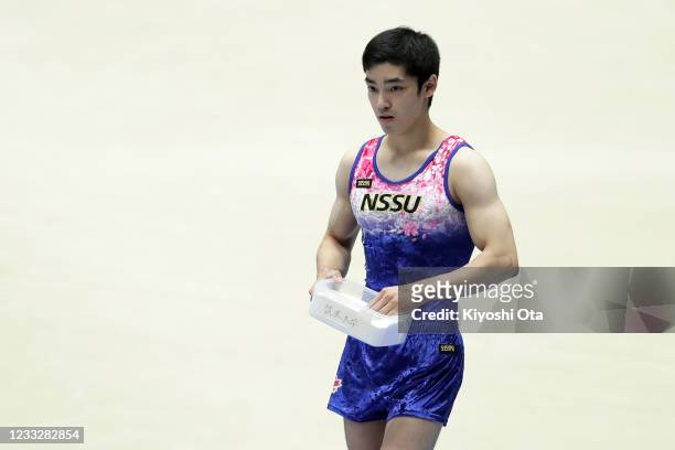 Kenzo Shirai prepares to compete in the Men's Floor Exercise qualifying round on day one of the 75th All Japan Artistic Gymnastics Apparatus...