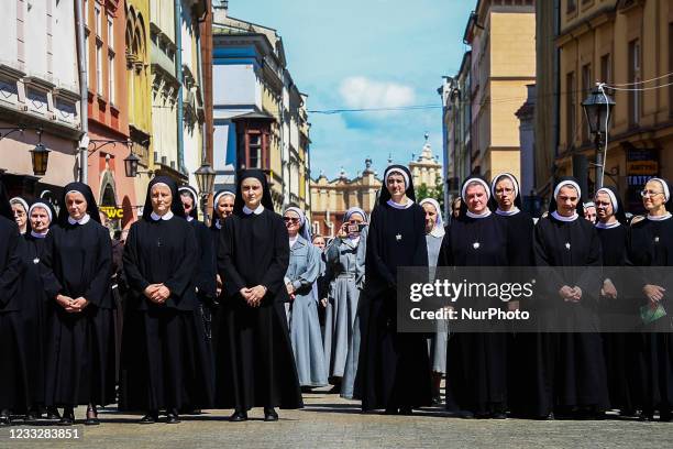 Nuns attend Corpus Christi procession during the coronavirus pandemic. Krakow, Poland on June 4, 2021. The procession starts with a priest carrying a...