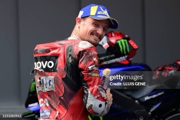 Ducati Australian rider Jack Miller celebrates after the MotoGP qualifying session ahead of the Moto Grand Prix de Catalunya at the Circuit de...