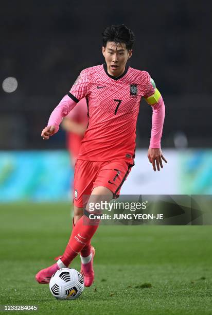 South Korea's Son Heung-min dribbles the ball against Turkmenistan during their Asian zone qualification football match for the FIFA World Cup Qatar...