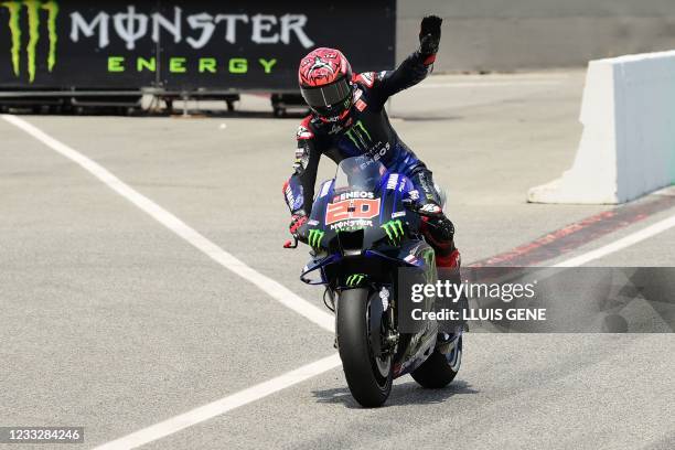 Yamaha French rider Fabio Quartararo celebrates getting pole position during the MotoGP qualifying session ahead of the Moto Grand Prix de Catalunya...