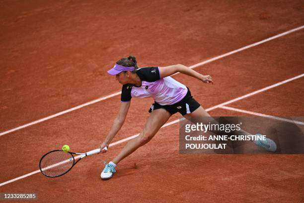 Belgium's Elise Mertens returns the ball to Greece's Maria Sakkari during their women's singles third round tennis match on Day 7 of The Roland...