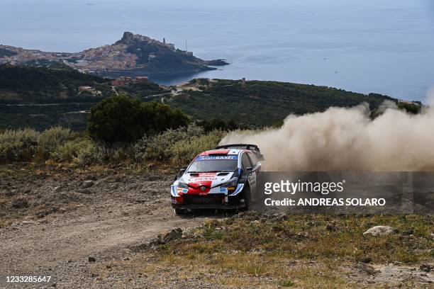 French driver Sebastien Ogier steers his Toyota Yaris WRC with French co-driver Julien Ingrassia, between Sedini and Castelsardo on June 05, 2021...
