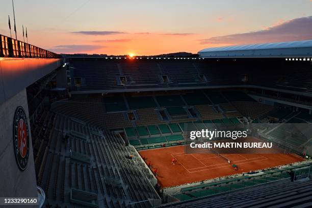 Switzerland's Roger Federer returns the ball to Germany's Dominik Koepfer during their men's singles third round tennis match at the Philippe...