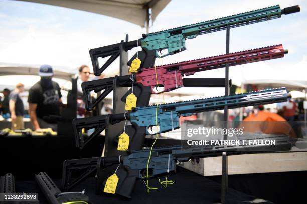 Valor Industries LLC California-compliant AR-15 style rifles chambered in 9mm are displayed for sale at a vendor booth at the Crossroads of the West...