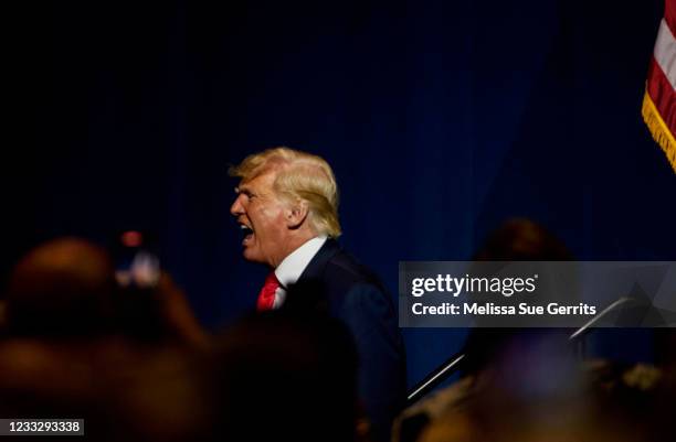 Former U.S. President Donald Trump exits the NCGOP state convention on June 5, 2021 in Greenville, North Carolina. The event is one of former U.S....