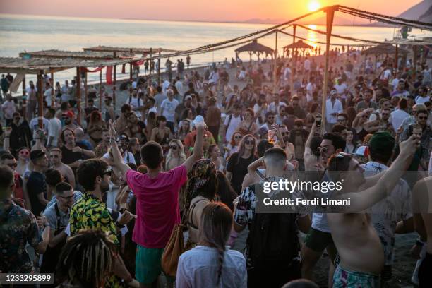 People dance during the Unum Festival at Rana e Hedhun beach on June 5, 2021 in Shengjin, Albania. International electronic musicians like Ben Klock...