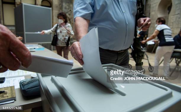 Voter casts his ballot at a polling station in Magdeburg's Art History museum on June 6 during regional elections in the German state of...