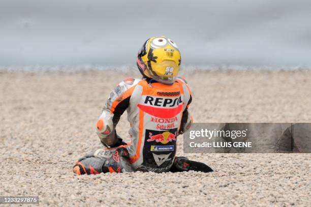 Honda Spanish rider Pol Espargaro reacts after falling during the MotoGP race of the Moto Grand Prix de Catalunya at the Circuit de Catalunya on June...