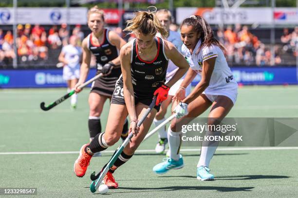 Hanna Granitzki of Germany vies with Ambre Ballenghien of Belgium during the European field Hockey Championship match between Germany and Belgium at...