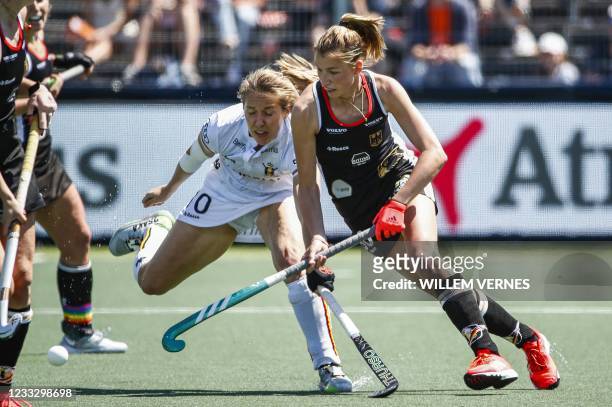 Louise Versavel of Belgium vies with Hanna Granitzki of Germany during the European field Hockey Championship match between Germany and Belgium at...