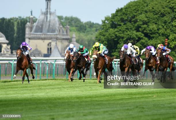 Spanish jockey Ioritz Mendizabal who rides St. Mark's Basilica leads the competition during the 181st edition of The Prix du Jockey-Club horse race...