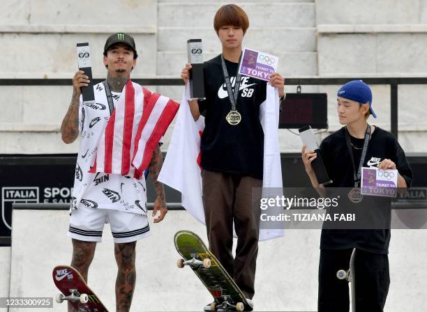 Winner Japanese skateboarder Yuto Horigome , runner-up US skateboarder Nyjah Huston and third-placed Japanese skateboarder Sora Shirai pose on the...