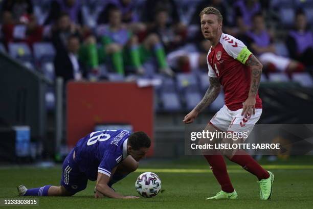 Denmark's defender Simon Kjaer and Bosnia-Herzegovina's midfielder Amir Hadziahmetovic vie for the ball during the friendly football match Denmark v...