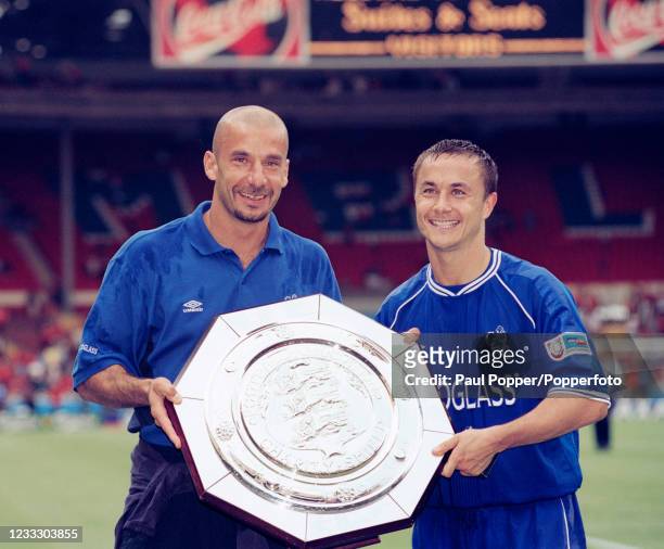 Chelsea manager Gianluca Vialli and captain Dennis Wise celebrate with the trophy after the FA Charity Shield between Chelsea and Manchester United...