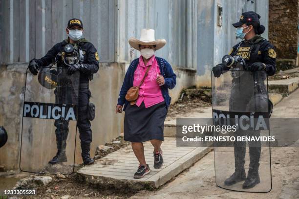 Woman arrives to casts her vote at a polling station in Tacabamba, Cajamarca region, north east of Peru, on June 06, 2021. - Peruvians face a...