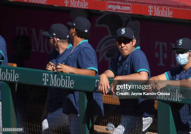 Yusei Kikuchi of the Seattle Mariners looks on from the dugout in the ninth inning against the Los Angeles Angels at Angel Stadium of Anaheim on June...