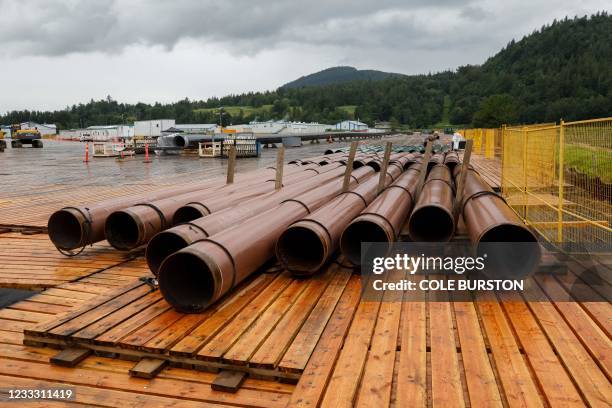 Pieces of the Trans Mountain Pipeline project sit in a storage lot outside of Abbotsford, British Columbia, Canada, on June 6, 2021. The Trans...