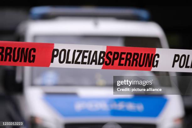June 2021, Saxony, Dresden: A riot police vehicle in the blur behind police cordon tape Photo: Tino Plunert/dpa-Zentralbild/ZB