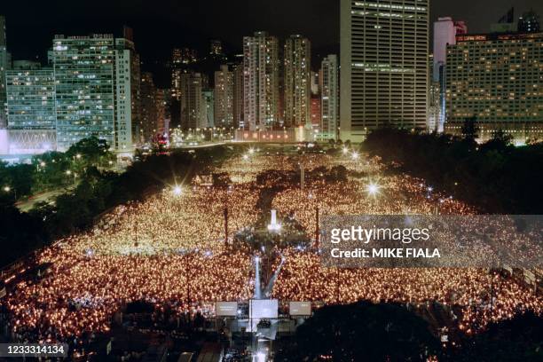 Sea of candles flicker over Hong Kong's Victoria Park during a candlelight vigil attended by some 100.000 to commemorate the first anniversary of the...
