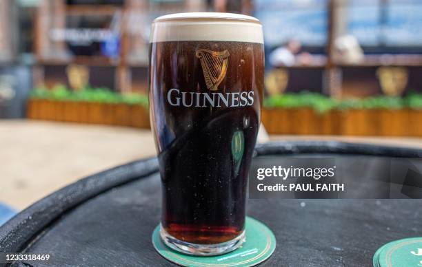 Freshly poured pint of Guinness is pictured in Dublin, on June 7 as bars, restaurants and cafes resumed outdoor service as part of the latest lifting...