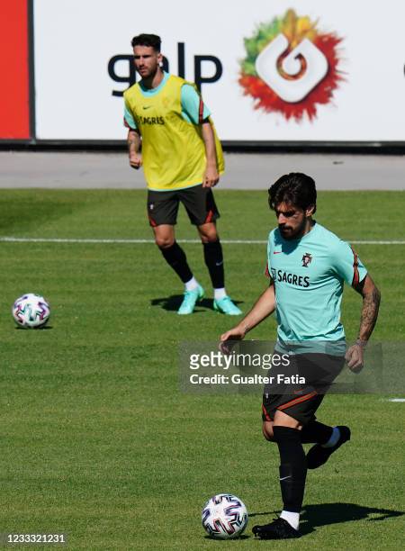 Ruben Neves of Portugal and Wolverhampton with Rafa Silva of Portugal and SL Benfica in action during the Portugal Training Session at Cidade do...
