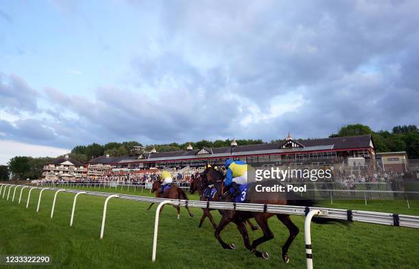 Flint Hill ridden by jockey Graham Lee leads on their way to winning the Tony Bethell Memorial Handicap at Pontefract racecourse on June 7, 2021 in...